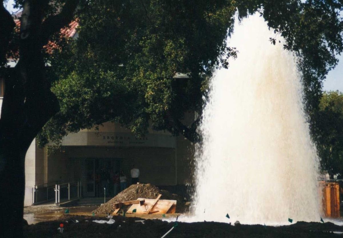 a geyser of water erupts outside Sequoia Hall
