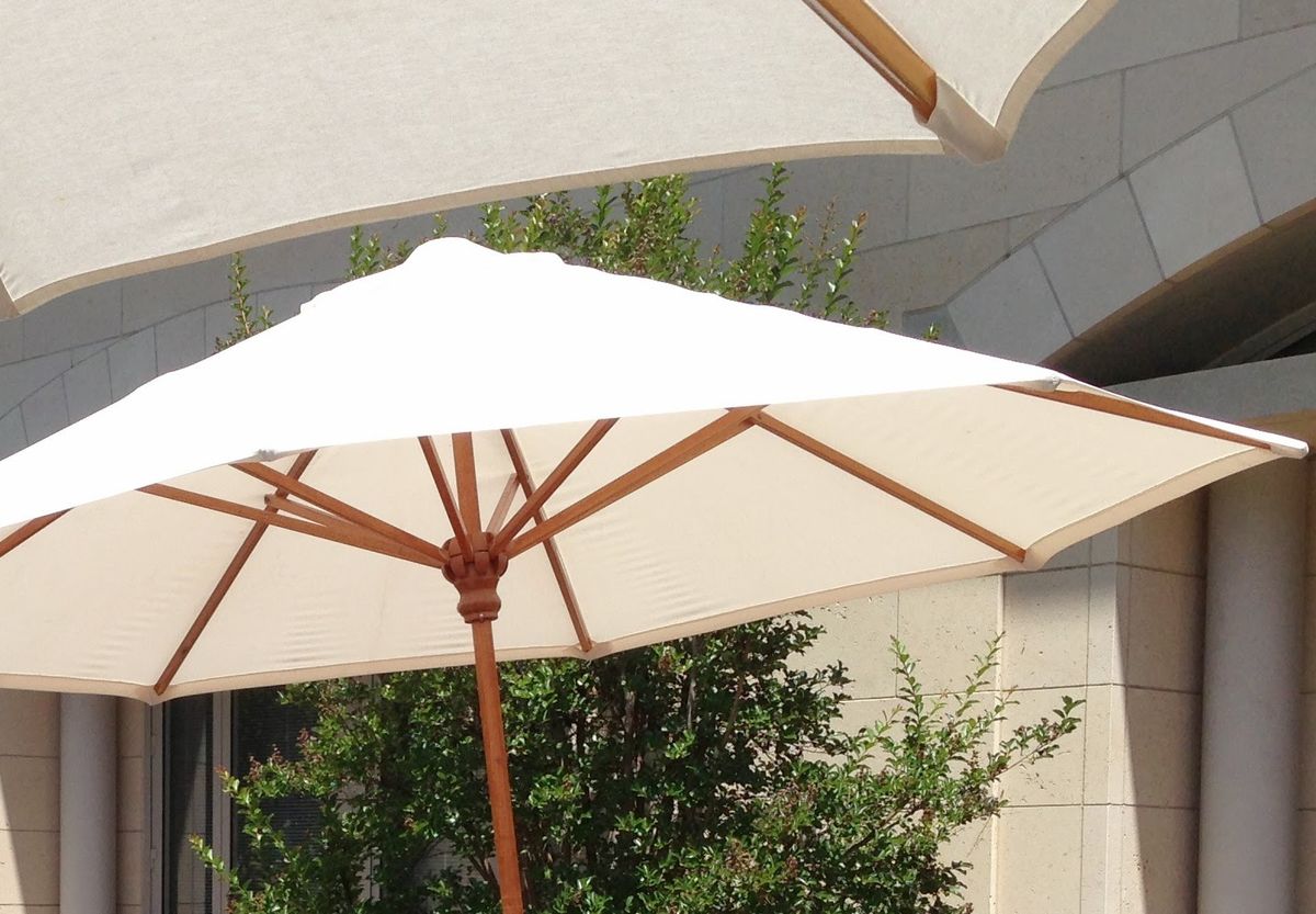white canvas umbrellas stand in Jacaranda Courtyard